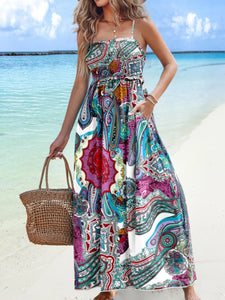 Woman wearing printed smocked maxi cami dress outdoors – Iconiqu Amsterdam