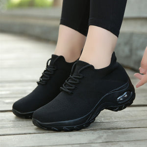 women shaking shoes fly knit sneakers